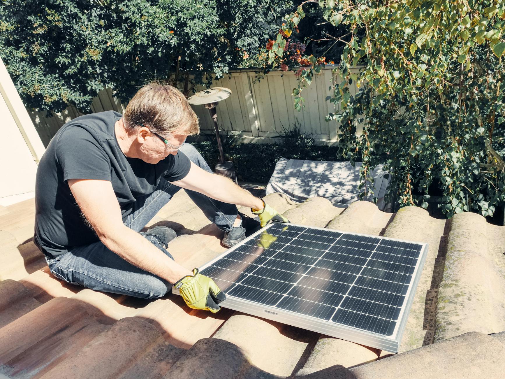 A close-up of high-quality architectural shingles being meticulously installed on a Cambridge roof.